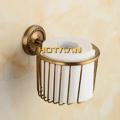 Antique brass bathroom set with ornate mounts and ceramic brush cup