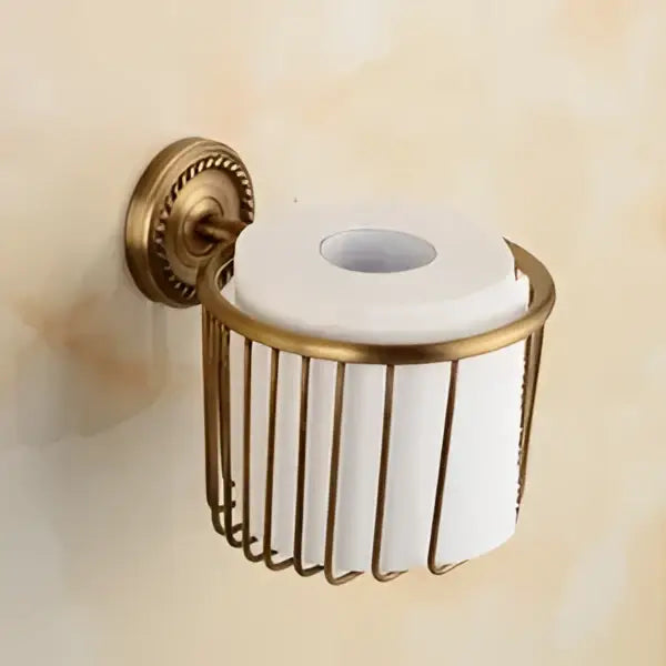 Antique brass bathroom set with ornate mounts and ceramic brush cup