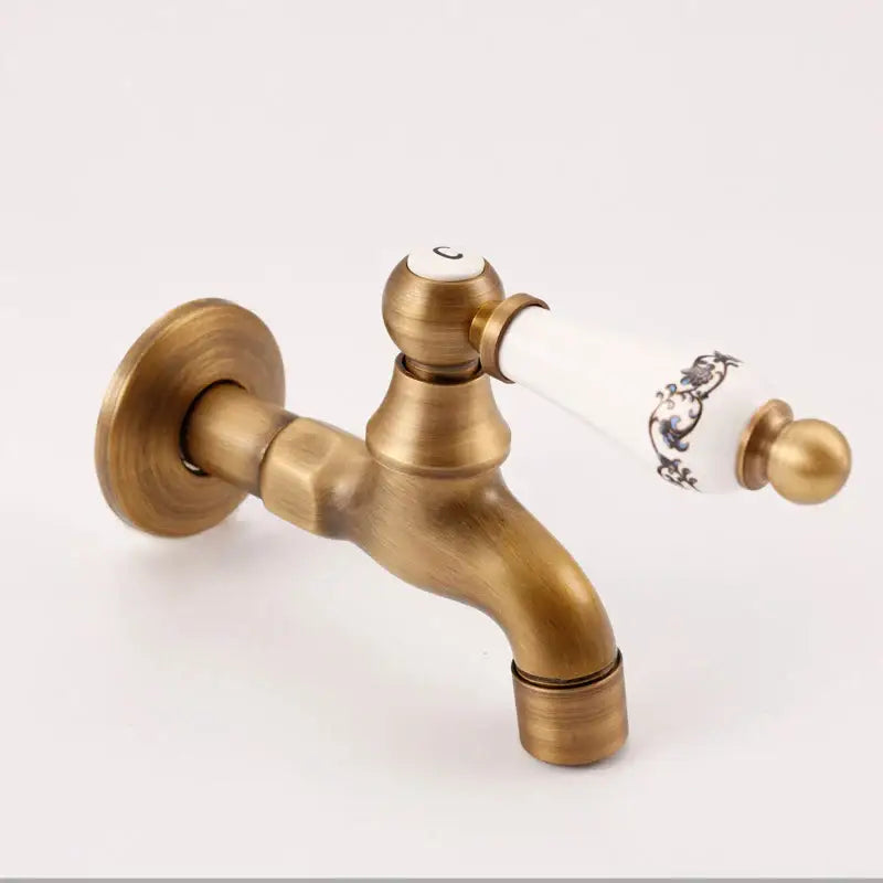 Antique brass bibcock faucet with floral ceramic handle garden tap