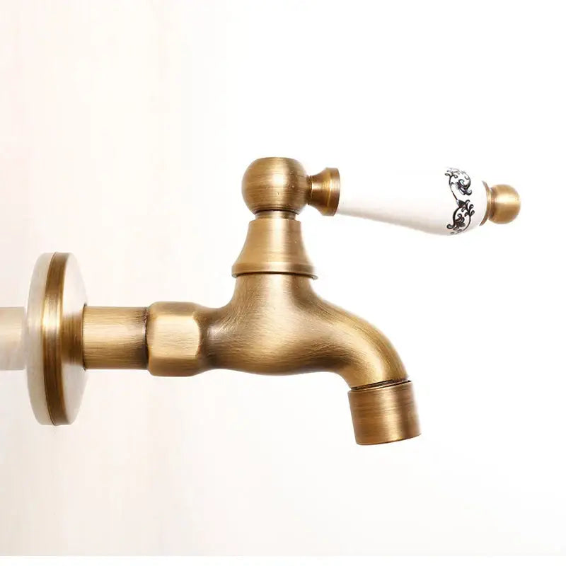 Antique brass bibcock faucet with floral ceramic handle garden tap