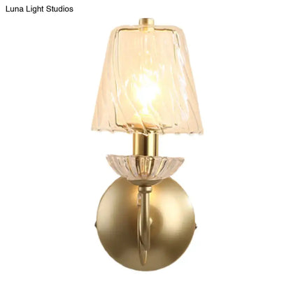 Antique brass conical sconce light with clear twisted glass bedroom