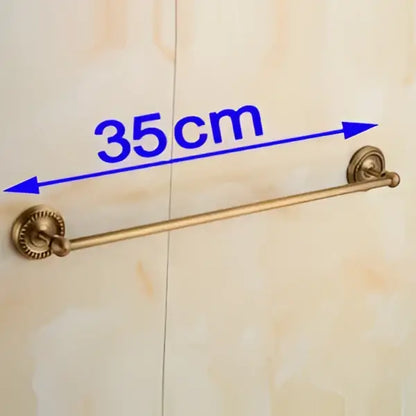 Antique brass single towel bar with ornate base for bathroom decor