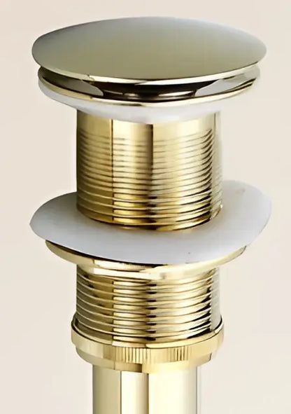 Antique brass sink drain with white rubber seal – bathroom waste