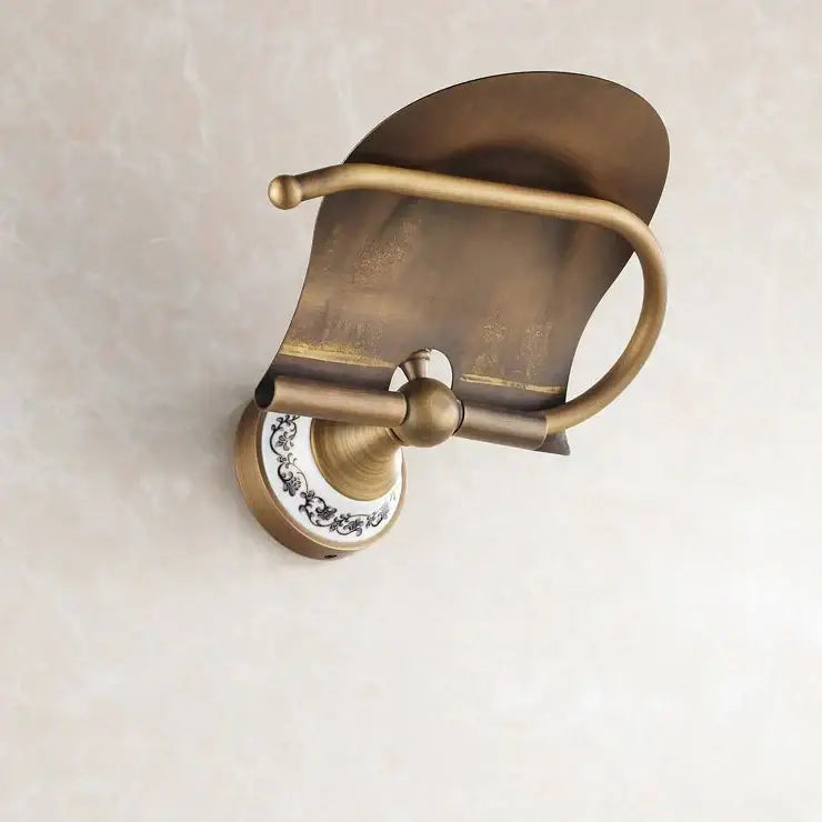 Antique brass wall mounted paper holder with ceramic base bathroom