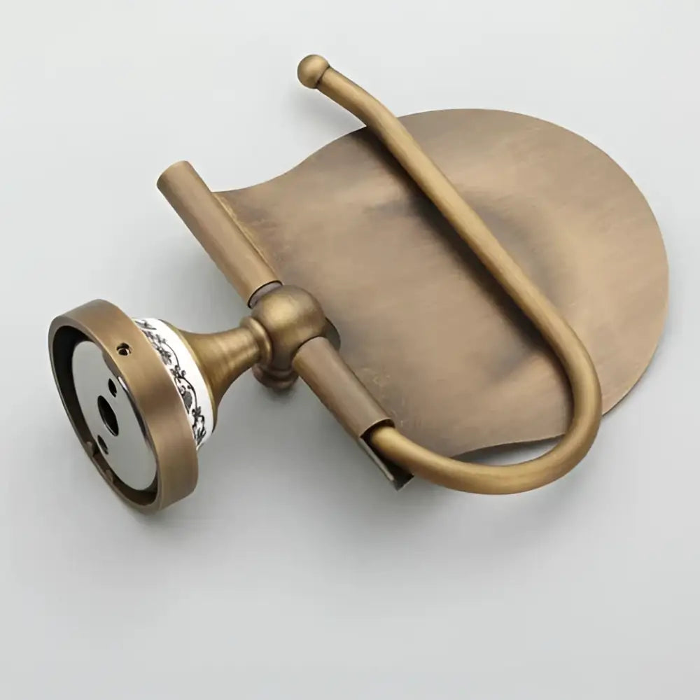 Antique brass wall mounted paper holder with ceramic base bathroom