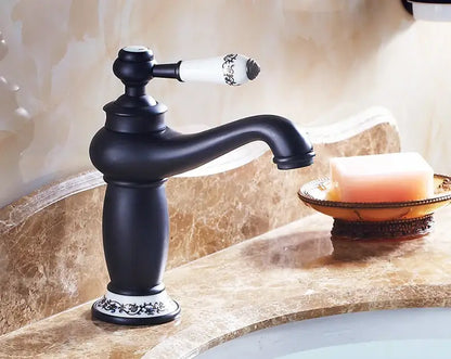 Antique bronze bathroom faucet with white ceramic ornate handle