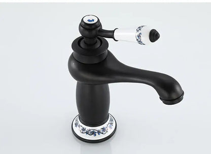 Antique bronze bathroom faucet with white ceramic ornate handle