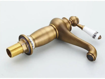 Antique bronze bathroom faucet with white ceramic ornate handle