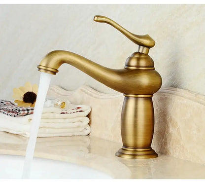 Antique bronze bathroom faucet with white ceramic ornate handle