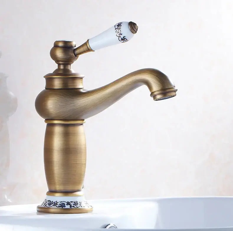 Antique bronze bathroom faucet with white ceramic ornate handle