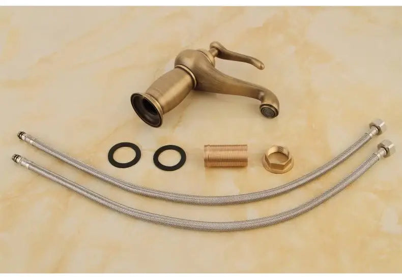 Antique bronze bathroom faucet with white ceramic ornate handle