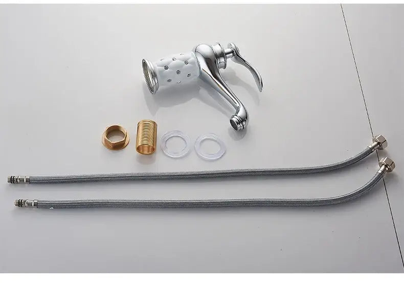 Antique bronze bathroom faucet with white ceramic ornate handle