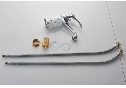Antique bronze bathroom faucet with white ceramic ornate handle