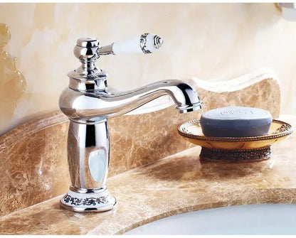 Antique bronze bathroom faucet with white ceramic ornate handle