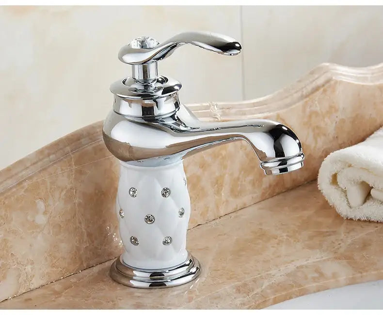 Antique bronze bathroom faucet with white ceramic ornate handle