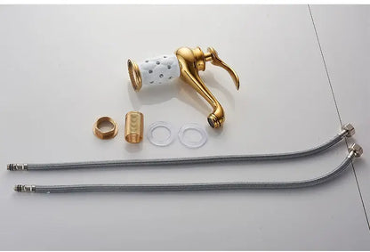 Antique bronze bathroom faucet with white ceramic ornate handle