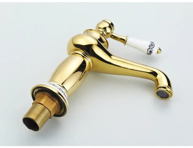 Antique bronze bathroom faucet with white ceramic ornate handle