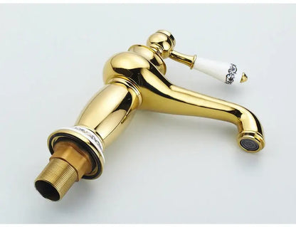 Antique bronze bathroom faucet with white ceramic ornate handle
