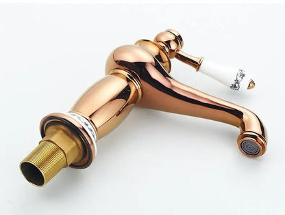 Antique bronze bathroom faucet with white ceramic ornate handle