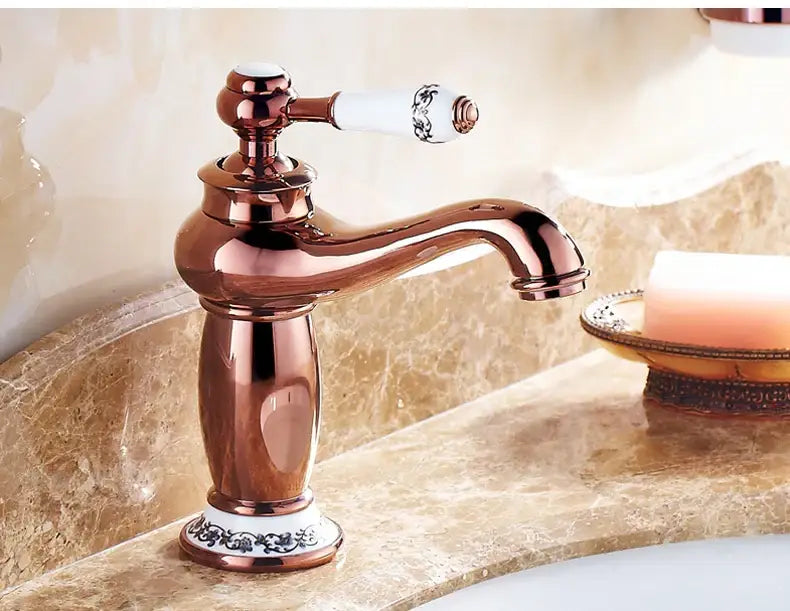 Antique bronze bathroom faucet with white ceramic ornate handle