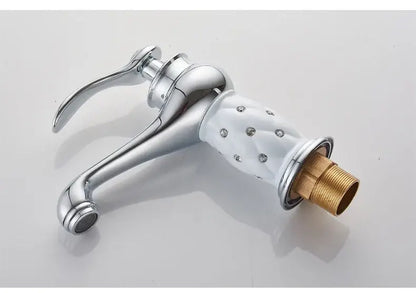 Antique bronze bathroom faucet with white ceramic ornate handle