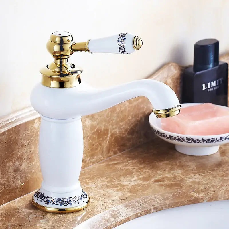 Antique bronze bathroom faucet with white ceramic ornate handle