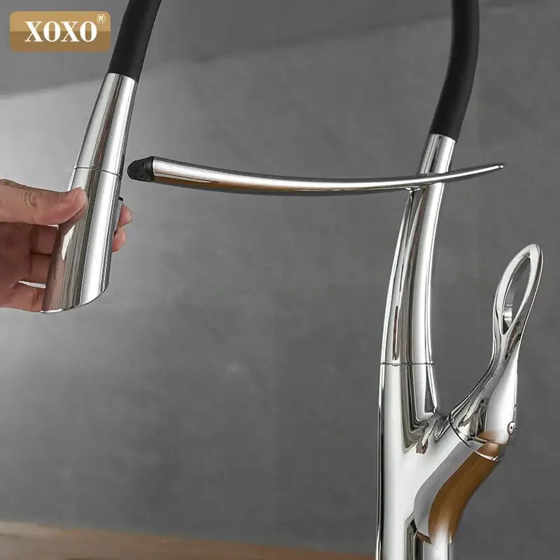Arched brushed nickel kitchen faucet with black rubberized hose