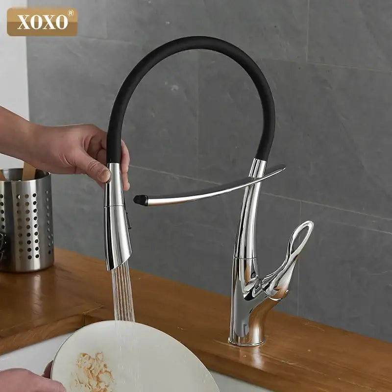 Arched brushed nickel kitchen faucet with black rubberized hose