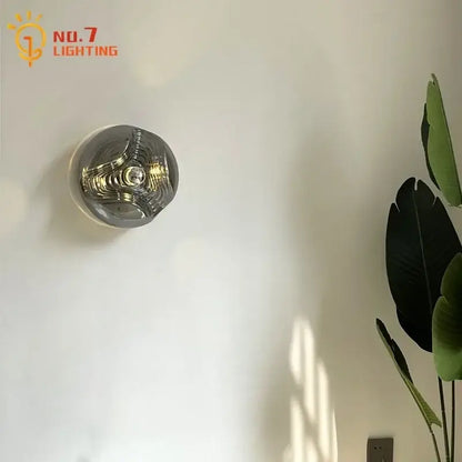 Bauhaus wavy glass wall lamp for bedroom clear and metallic light