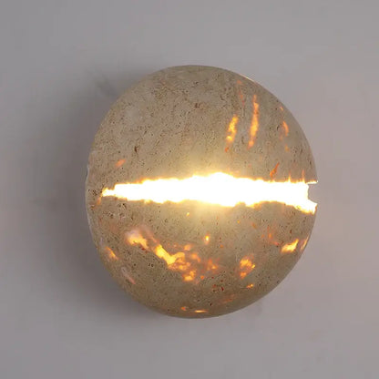 Beige dino egg stone wall lamp with gold accent for bedroom