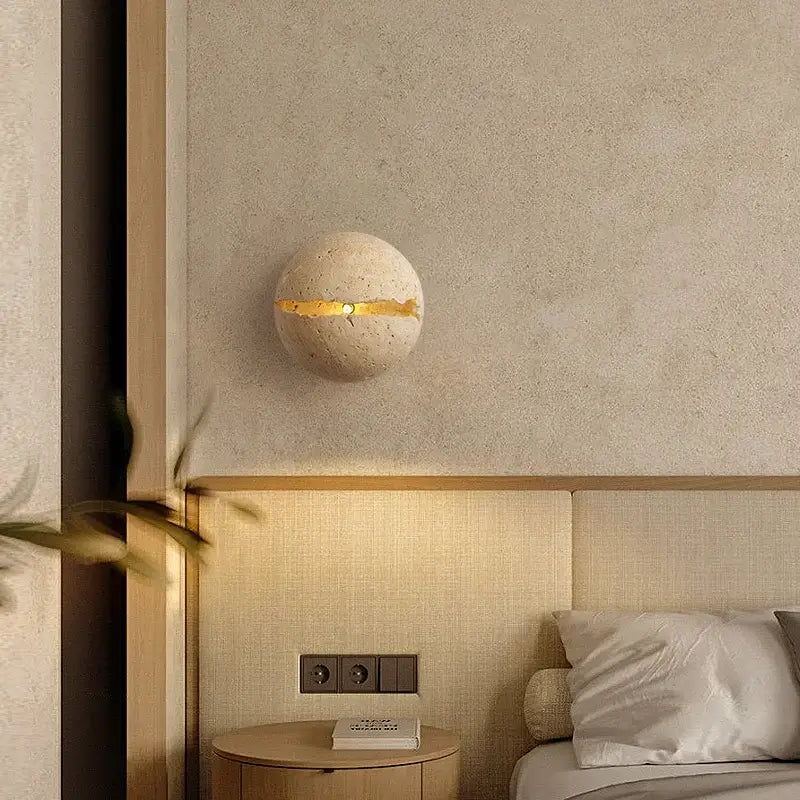 Beige dino egg stone wall lamp with gold accent for bedroom