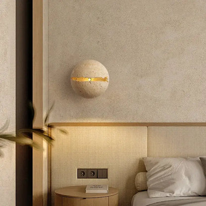 Beige dino egg stone wall lamp with gold accent for bedroom