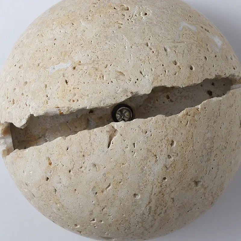 Beige dino egg stone wall lamp with gold accent for bedroom