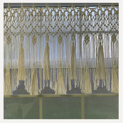 Beige handwoven macrame window curtain with tassels – living room