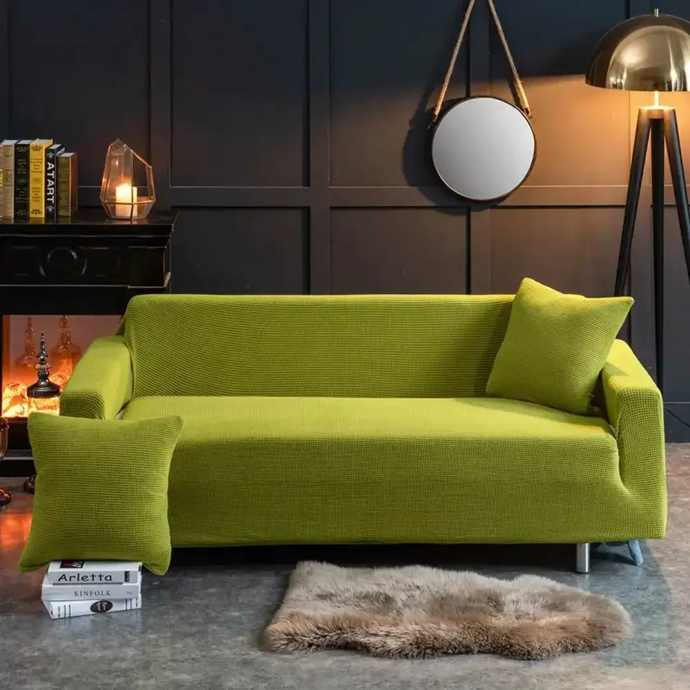 Beige textured quilted sofa cover with pillows for living room