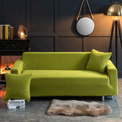 Beige textured quilted sofa cover with pillows for living room