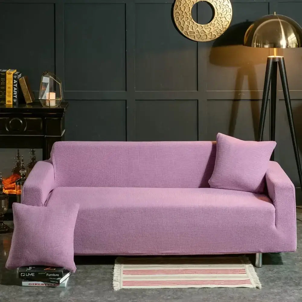 Beige textured quilted sofa cover with pillows for living room