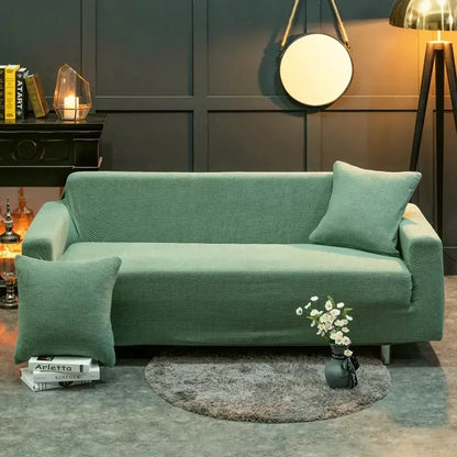 Beige textured quilted sofa cover with pillows for living room