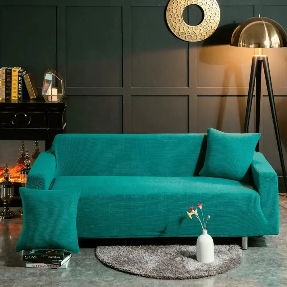 Beige textured quilted sofa cover with pillows for living room