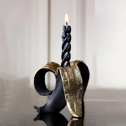 Black and gold banana candlestick holder for dining room decor