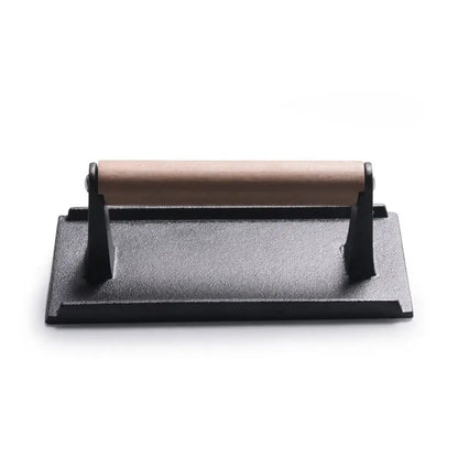 Black and light brown cast iron burger press kitchen meat tool