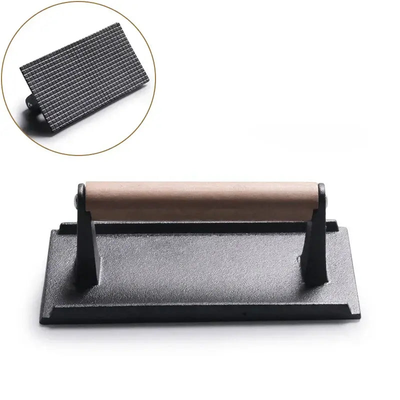 Black and light brown cast iron burger press kitchen meat tool