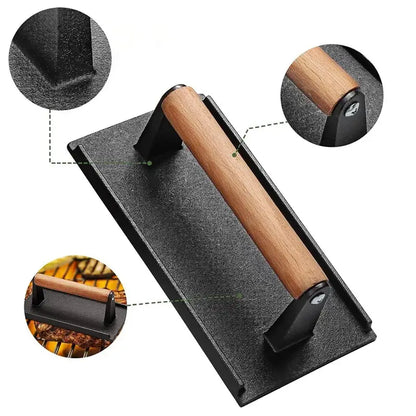 Black and light brown cast iron burger press kitchen meat tool