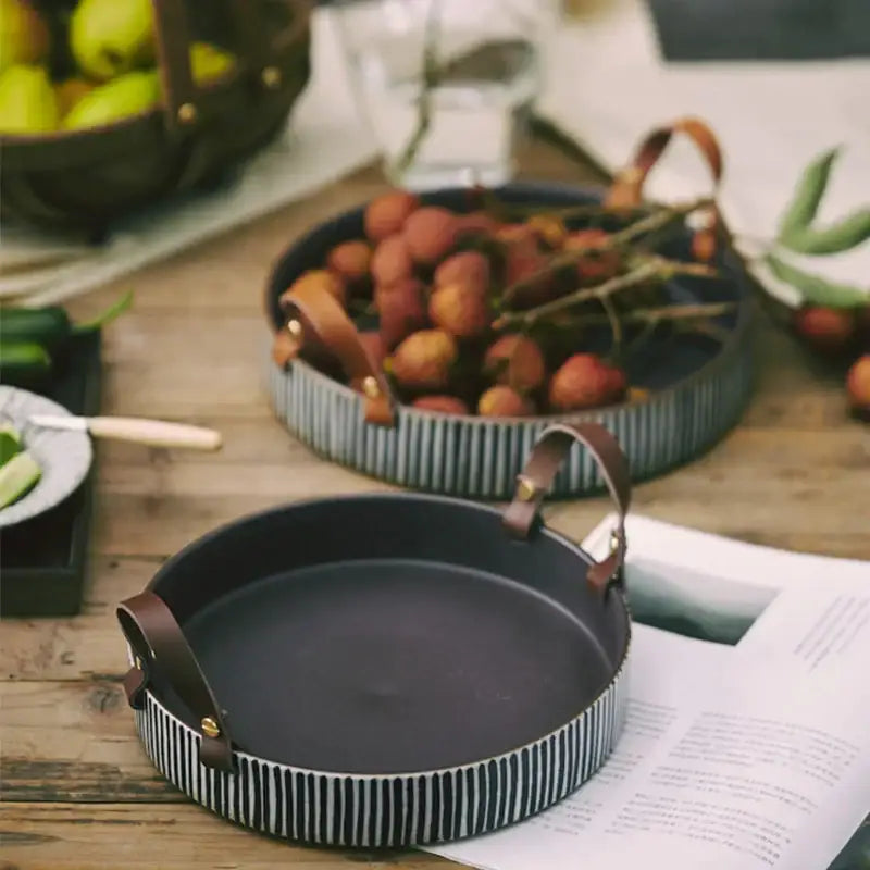 Black and white striped porcelain bowl with leather handle dining room