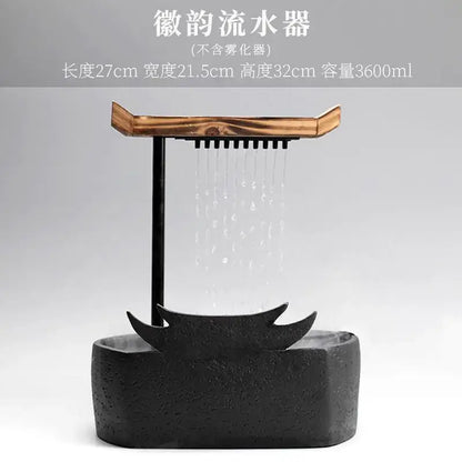 Black ceramic water fountain with wood roof living room decor