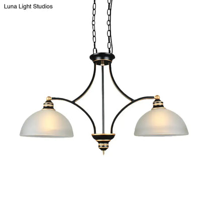 Black and gold dome chandelier with white glass shades dining room