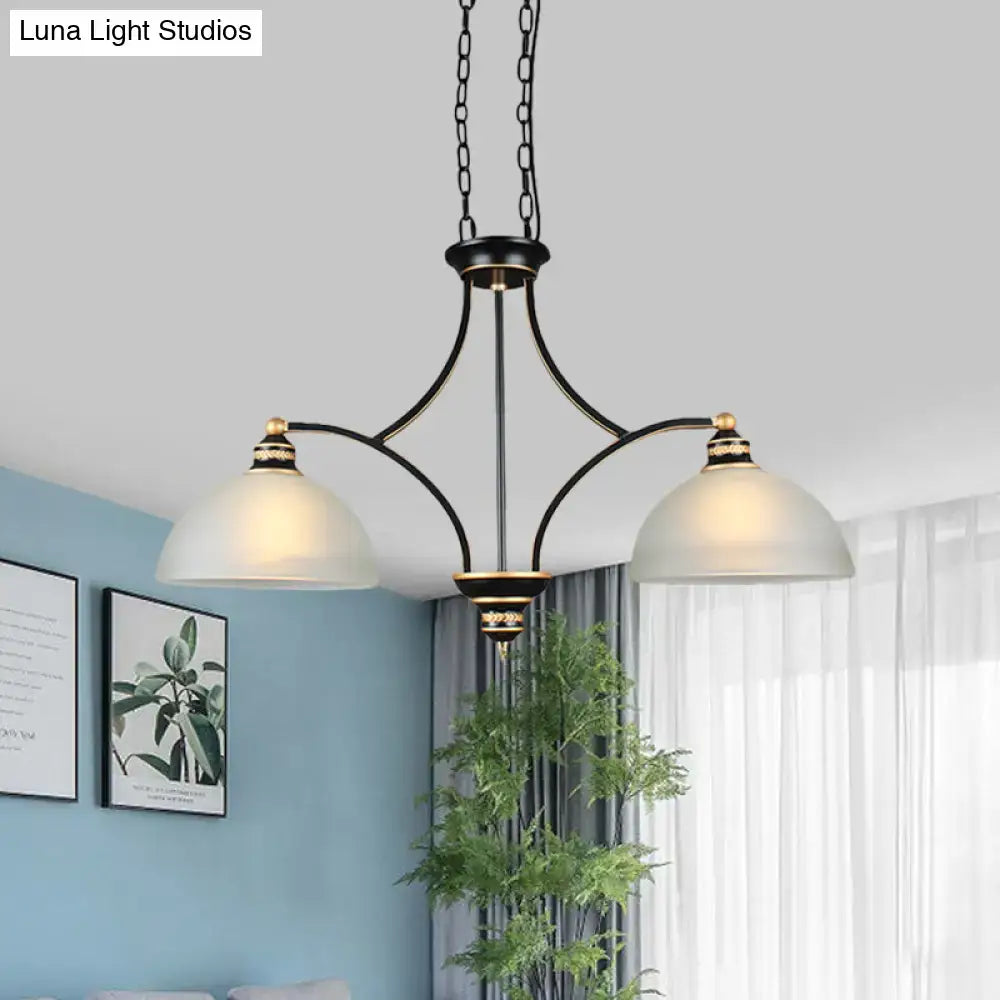 Black and gold dome chandelier with white glass shades dining room