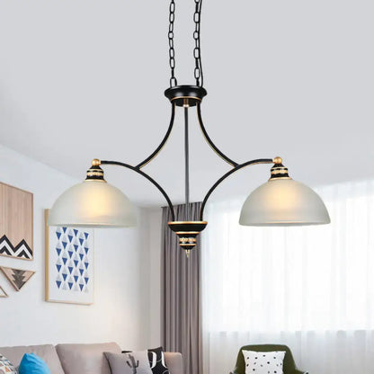 Black and gold dome chandelier with white glass shades dining room