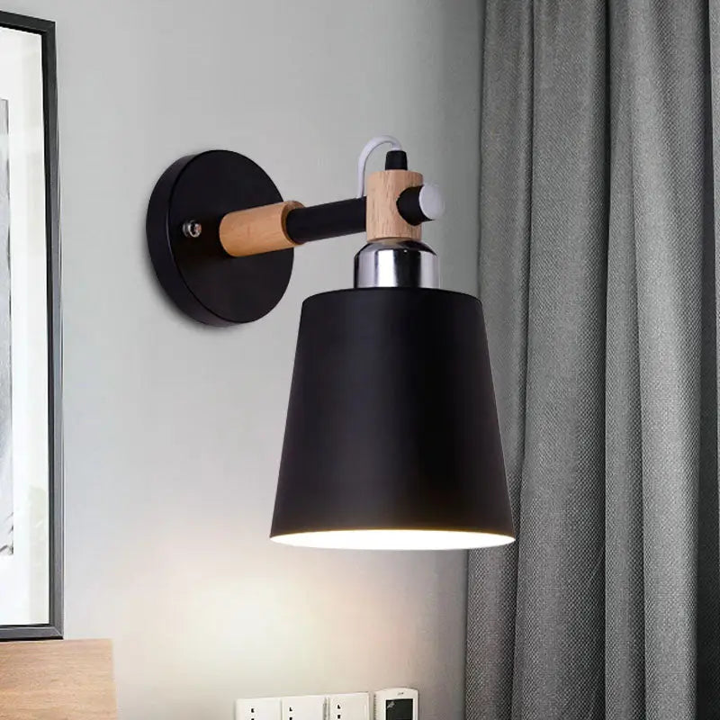 Black matte wall lamp with empire shade and wood arm for stairs