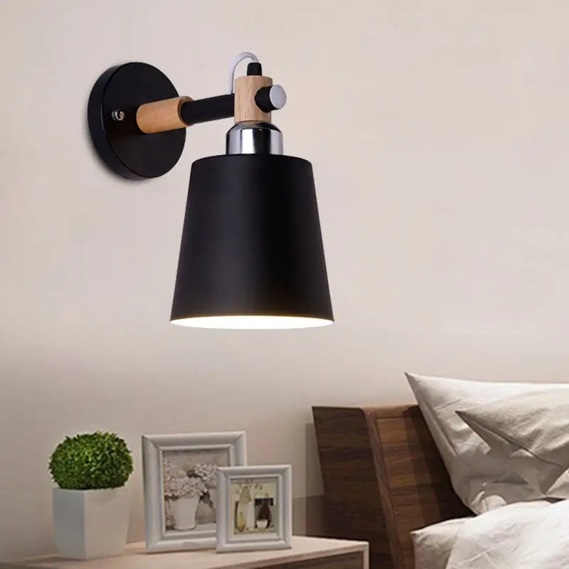 Black matte wall lamp with empire shade and wood arm for stairs